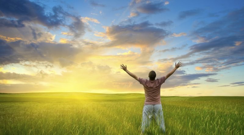 man standing in field